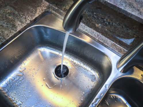 Water flowing freely down a Greenville kitchen sink